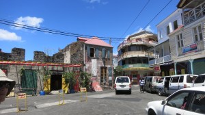 Roseau, the capital and largest city in Dominica. The white vans are all buses.