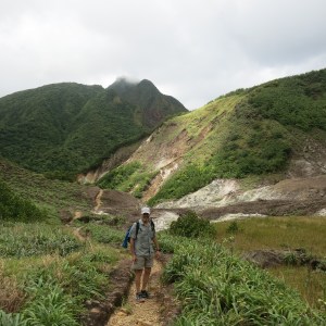 The trail to Boiling Lake. The peak in the distance (that is in the clouds) was the highest point we climbed to that day. We stood on top of that peak and could see both oceans on both sides of the island.