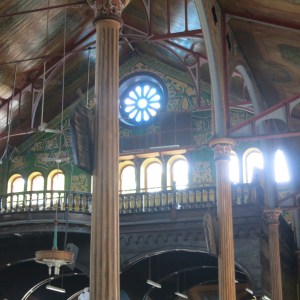 Inside the Cathedral in Castries. The fluting and rosettes on the columns are painted. The walls and ceilings are covered with murals too.