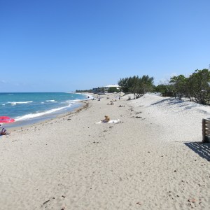 This is a typical east Florida beach with white sand stretching on farther than the eye can see.