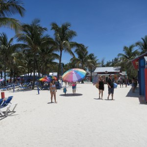 People commonly use umbrellas here as sun shades. Here is a dad who pulled up his beach umbrella to take a walk with his daughter.
