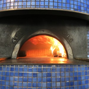 The pizza oven imported from Naples at a stop on our food history tour. It is about 1000 degrees in the oven. They only burn oak and are able to cook a pizza in 90 seconds! It was delicious.
