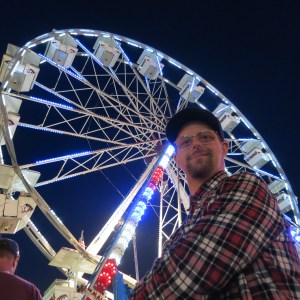 Adam in line to ride the ferris wheel