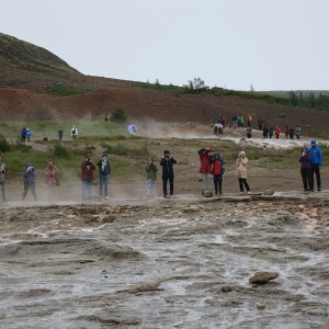 We were such a startling sight, these people lined up to take our picture. Oh no, they are actually waiting for the geyser to erupt.