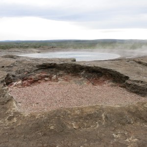 Geysir, the original geyser, is so old it is now retired and just steams. It does not please the tourists they way it used to.