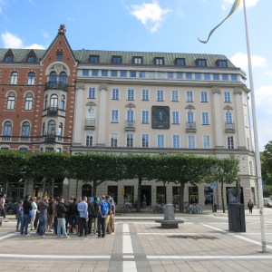 The white building houses a bank that was robbed in 1973. The robbers held hostages for six days while negotiating with police. During that time, the hostages came to empathize with their captors, which led to the identification and labeling of Stockholm Syndrome.