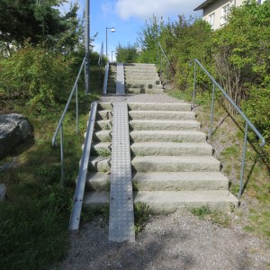 Every stairway we've seen in Sweden has accessibility track for bicycles and baby strollers