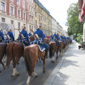 Stockholm. Royal soldiers making their way to the palace. Note the mock bedroll at the back of each saddle; these folks are not sleeping outside today.