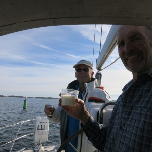 Paying respect at the famous "Kejsaren" navigation marker. Someone put a crown on this decades ago and now sailors toast as they pass, offering thanks for a safe passage.