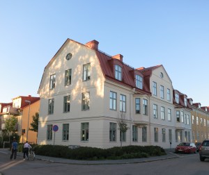 Megan and Eva walking into Eva’s apartment. It is on the top floor of this building. The builder tore down a decayed historic building on this location and built modern housing while recreating the original exterior appearance.
