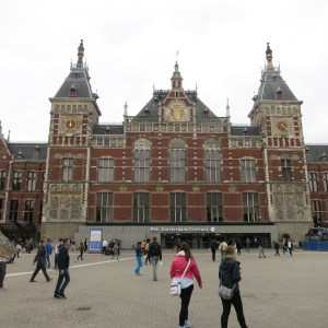 The Central Train Station in Amsterdam. The tower on the right is a clock, on the left is a wind vane.