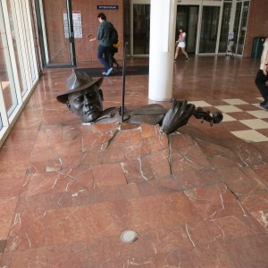 Sculpture of the unknown violinist. The tour guide said this sculpture appeared one morning in a canal. The artist has remained anonymous and has secretly delivered about a dozen other sculptures into the city. The officials wouldn't let this one stay in the canal so they moved it to the foyer of the opera house.