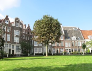 Begijnhof in Amsterdam. This is a community established for and by single women in the Middle Ages. They wanted to live a religious life in the world, less secluded than nuns, and with a community to care for each other. Today, all residents are still single women. It was a quiet oasis through a mostly hidden wooden door in the middle of the oldest part of the city.
