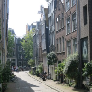 On the center right, an example of a house intentionally leaning forward out into the street.