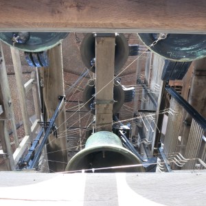 Some of the 47 bells that make up the carillon in the Belfort. Note all the wires that allow the bells to be played by a central keyboard.