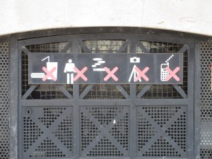 Behavior guidelines posted on top of the Arc de Triomphe. The French really love their speedos!