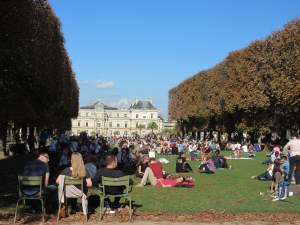 Another park packed with quiet locals enjoying a sunny afternoon.