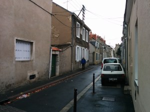 The street Jim lived on as taken in 2014. Jim is standing in front of his old house.