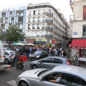 The corner building was our first rental. Our apartment had the fourth balcony up. One the street below, you can see the black market crowd congregating.