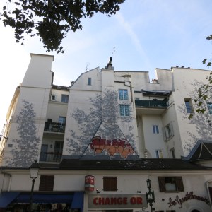 The "shadows" on this wall are a mural; another great example of public art in Paris.