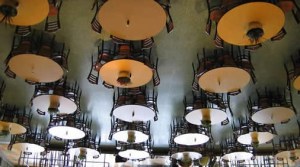 Looking up, the tables and chairs were actually suspended from the ceiling.