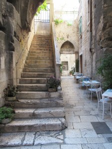 Inside the Palace. Stairs lead up to private residences, the passage on the right opens into a courtyard.