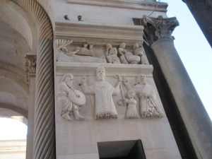 The entrance to Diocletian's mausoleum turned cathedral. The Roman column stands next to more recent Christian carvings in this town that keep layering history upon itself.