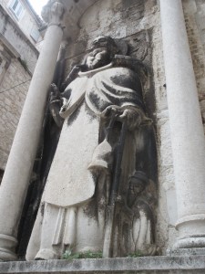 St. Anthony. The small man in the lower right donated the sculpture and didn't want his gift to be forgotten. Our guidebook calls this figure "mini-me."