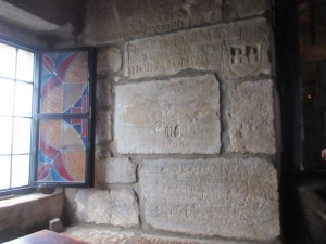 Inside the castle, Crusaders carved on the walls. The upper carving showing a crest is dated 1492..