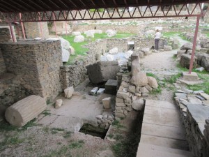 What is left of the Mausoleum today. The large rock in the center was installed as a plug to Mausolus's tomb, which was deep under the monument.