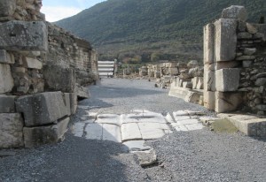 Grooves in the marble pavers from the passage of thousands of carts.
