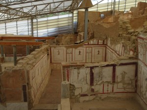 Layers of painted murals in a Terrace House.
