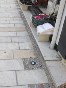 The blue eye amulets, called nazar, are everywhere and often built into walls and sidewalks. It is believed to provide protection from the Evil Eye and likely dates back to the 16th century BC when glasswork developed.