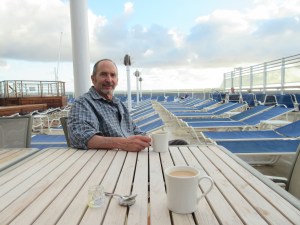 Jim enjoys his coffee and Megan her tea while supervising the deck chairs.