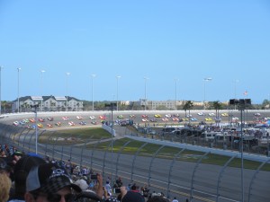 Daytona 500. The cars are sedate and well-spaced because they are following the pace car.